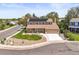 Charming two-story home with a well-manicured lawn, covered front porch and solar panels at 3298 W 11Th Avenue Pl, Broomfield, CO 80020