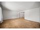 Empty living room with neutral carpet and white walls, ready for customization at 3298 W 11Th Avenue Pl, Broomfield, CO 80020