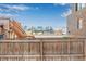 View from backyard over fence; city skyline visible at 2512 Kensing Ct, Denver, CO 80211