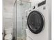 Clean bathroom with a walk-in shower, toilet and stackable washer/dryer at 2512 Kensing Ct, Denver, CO 80211