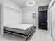 Well-lit bedroom featuring a Murphy bed and an open concept at 2512 Kensing Ct, Denver, CO 80211