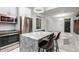 Modern kitchen with white cabinets, marble countertops, and stainless steel appliances at 2512 Kensing Ct, Denver, CO 80211