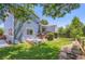 Inviting backyard featuring a deck with outdoor seating and a well-maintained lawn at 1201 Trout Creek Cir, Longmont, CO 80504