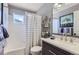 Well-maintained bathroom featuring a shower-tub combo, modern vanity, and updated fixtures at 1201 Trout Creek Cir, Longmont, CO 80504