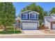 Charming two-story home with a well-maintained lawn, classic siding, and a two car garage in a suburban neighborhood at 1201 Trout Creek Cir, Longmont, CO 80504