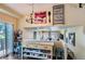 Open-concept kitchen with counter seating, stylish pendant lighting, and an open view to the living room at 1201 Trout Creek Cir, Longmont, CO 80504
