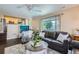 Comfortable living room showcasing a neutral rug, a large window, and a cozy seating area at 1201 Trout Creek Cir, Longmont, CO 80504