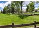 Expansive green lawn for outdoor activities at 4 Oakmont Ln, Littleton, CO 80127