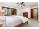 Bedroom with carpet, natural lighting from windows with wood trim, and wood accents at 4 Oakmont Ln, Littleton, CO 80127