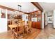 Inviting dining area flowing into the kitchen, perfect for entertaining at 4 Oakmont Ln, Littleton, CO 80127