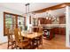 Cozy dining room with wooden table, chairs, and a large window offering a bright, inviting space at 4 Oakmont Ln, Littleton, CO 80127