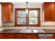 Well-lit kitchen sink with a large window, offering a pleasant view and ample natural light at 4 Oakmont Ln, Littleton, CO 80127