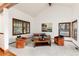 Spacious living room with ample natural light, neutral carpet, and comfortable seating at 4 Oakmont Ln, Littleton, CO 80127