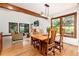 Open concept living space with dining area and living room with hardwood floors at 4 Oakmont Ln, Littleton, CO 80127