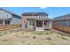 Spacious backyard featuring a covered porch and fenced yard, ideal for outdoor enjoyment at 892 High Point Trl, Elizabeth, CO 80107
