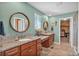 Elegant bathroom with double vanity, granite countertops, and modern fixtures at 892 High Point Trl, Elizabeth, CO 80107
