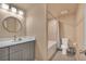 Bathroom features new vanity, sink, mirror, lighting, and bathtub with tile surround at 892 High Point Trl, Elizabeth, CO 80107