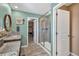 Bright bathroom with a glass enclosed shower and walk-in closet at 892 High Point Trl, Elizabeth, CO 80107