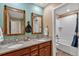 Bathroom with double vanity sinks and a shower and tub combination at 892 High Point Trl, Elizabeth, CO 80107