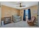 Bright Bedroom with a crib, dresser, and rocking chair at 892 High Point Trl, Elizabeth, CO 80107