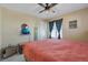 Cozy bedroom with a ceiling fan and a large window at 892 High Point Trl, Elizabeth, CO 80107