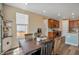 Cozy dining area connecting to the kitchen with natural light and modern fixtures at 892 High Point Trl, Elizabeth, CO 80107