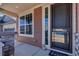 Charming front porch with stone accents and a welcoming entrance, perfect for relaxing outdoors at 892 High Point Trl, Elizabeth, CO 80107