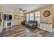 Comfortable living room with large windows, fireplace, and stylish furnishings at 892 High Point Trl, Elizabeth, CO 80107