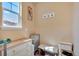 Well-lit mud room features a window, dresser, and hooks at 892 High Point Trl, Elizabeth, CO 80107