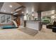 Finished basement featuring a treadmill, wet bar, and recreation area at 1609 S Catawba Cir, Aurora, CO 80018