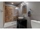 Modern bathroom with tiled shower, stylish vanity, and sleek fixtures at 1609 S Catawba Cir, Aurora, CO 80018