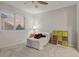 Bedroom with carpet floors featuring a ceiling fan and large windows at 1609 S Catawba Cir, Aurora, CO 80018