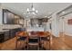 Open concept kitchen and dining area with hardwood floors at 1609 S Catawba Cir, Aurora, CO 80018