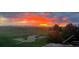 Scenic golf course view with vibrant sunset sky, providing a tranquil outdoor living experience at 1609 S Catawba Cir, Aurora, CO 80018