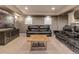Spacious living room featuring comfortable leather seating, contemporary media center, and neutral color palette at 1609 S Catawba Cir, Aurora, CO 80018