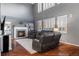 Bright living room with fireplace, large windows and high ceilings at 1609 S Catawba Cir, Aurora, CO 80018