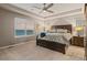 Spacious main bedroom with tray ceiling, carpeted floors and large windows at 1609 S Catawba Cir, Aurora, CO 80018