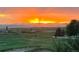 Breathtaking sunset over mountains and green fields, serene and picturesque at 1609 S Catawba Cir, Aurora, CO 80018