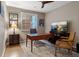 Cozy home office with a ceiling fan, natural light, and comfortable seating area and workspace at 1609 S Catawba Cir, Aurora, CO 80018