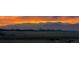 Picturesque view of mountains at sunset, with clear skies behind what looks like radar domes at 1609 S Catawba Cir, Aurora, CO 80018