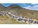Scenic aerial view of a modern neighborhood surrounded by open space and beautiful mountain views at 4745 Mesa Top Dr, Monument, CO 80132