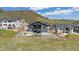 The backyard shows a private fenced yard with a patio, perfect for outdoor living and entertaining at 4745 Mesa Top Dr, Monument, CO 80132
