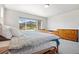 Bedroom with a large window offering scenic mountain views at 4745 Mesa Top Dr, Monument, CO 80132