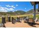 Spacious deck with outdoor furniture overlooking beautiful mountain views and treed valley at 4745 Mesa Top Dr, Monument, CO 80132