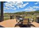 Outdoor deck with furniture offering beautiful views of the mountain landscape at 4745 Mesa Top Dr, Monument, CO 80132