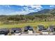 Beautiful exterior elevation shows a modern home with stunning mountain views and mature landscaping at 4745 Mesa Top Dr, Monument, CO 80132