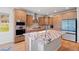Beautiful kitchen with custom cabinetry, granite countertops, stainless steel appliances, and a center island at 4745 Mesa Top Dr, Monument, CO 80132