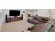 Media room with a large brown leather sectional and a large tv at 4745 Mesa Top Dr, Monument, CO 80132