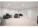 Large living room featuring neutral walls and carpeting with a desk and chair area at 4745 Mesa Top Dr, Monument, CO 80132