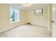 Finished basement bedroom with window and new flooring at 8501 E 104Th Ave, Henderson, CO 80640